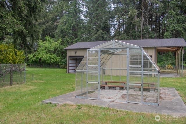 9844 173rd Avenue Southwest Rochester, WA 98579 - Photo 29 of 38 a backyard of a house with table and chairs