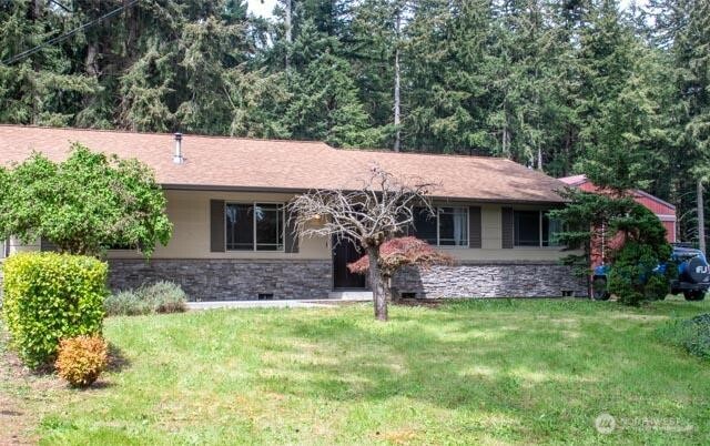 9844 173rd Avenue Southwest Rochester, WA 98579 - Photo 3 of 38 a front view of a house with a garden and plants