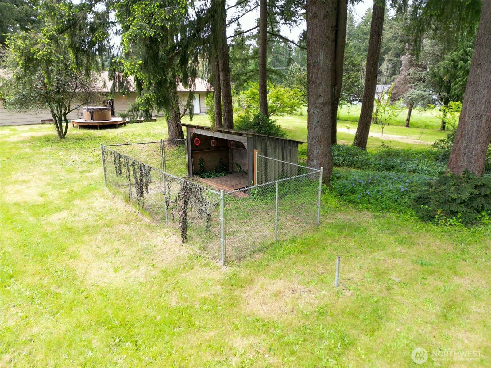 9844 173rd Avenue Southwest Rochester, WA 98579 - Photo 37 of 38 a backyard of a house with table and chairs