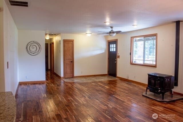 9844 173rd Avenue Southwest Rochester, WA 98579 - Photo 5 of 38 a view of an empty room with window and wooden floor