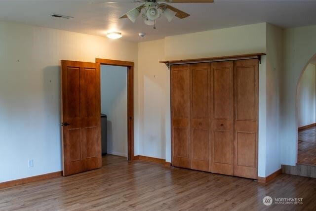 9844 173rd Avenue Southwest Rochester, WA 98579 - Photo 10 of 38 an empty room with wooden floor
