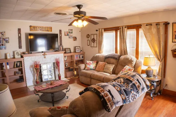 a living room with furniture and a flat screen tv