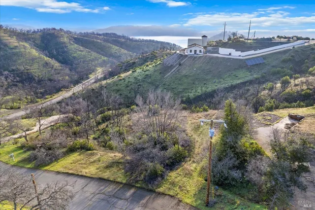 a view of a town with mountains in the background