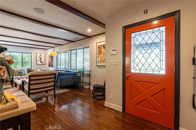 a bedroom with furniture and a window