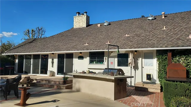 a view of house with outdoor seating space