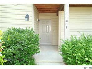 11038 Running Ridge Road, Unit 8421 Charlotte, NC 28226 - Photo 3 of 16 a view of a house with a yard and potted plants
