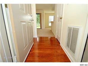 11038 Running Ridge Road, Unit 8421 Charlotte, NC 28226 - Photo 4 of 16 a view of a hallway with wooden floor