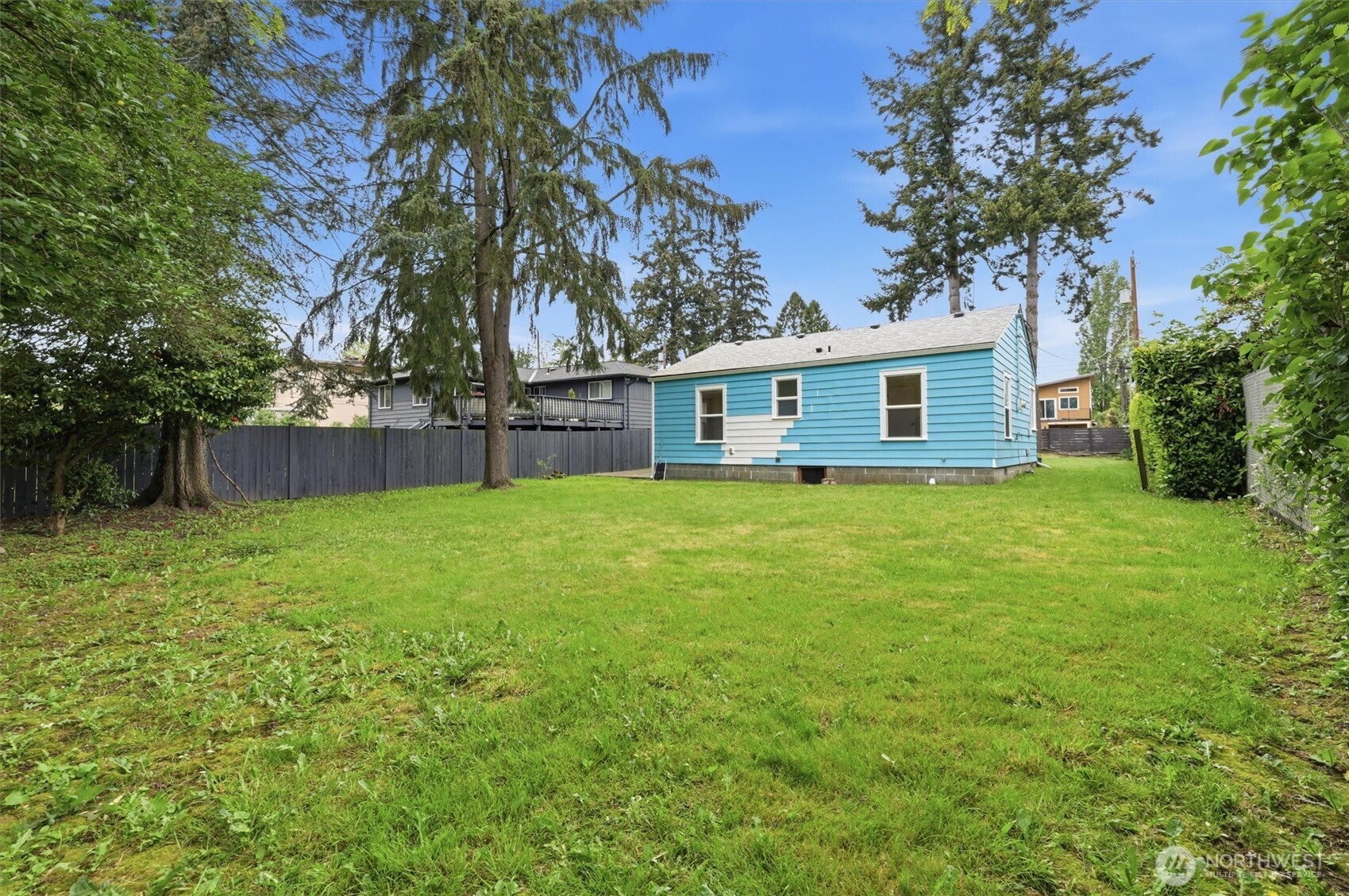 1651 Southwest 114th Street Seattle, WA 98146 - Photo 31 of 37 a view of a house with a backyard