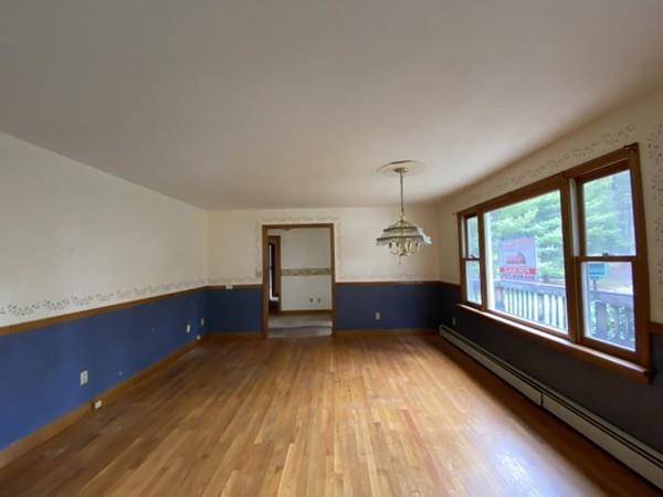 93 Old Poor Farm Road Ware, MA 01082 - Photo 17 of 27 wooden floor in an empty room with a window