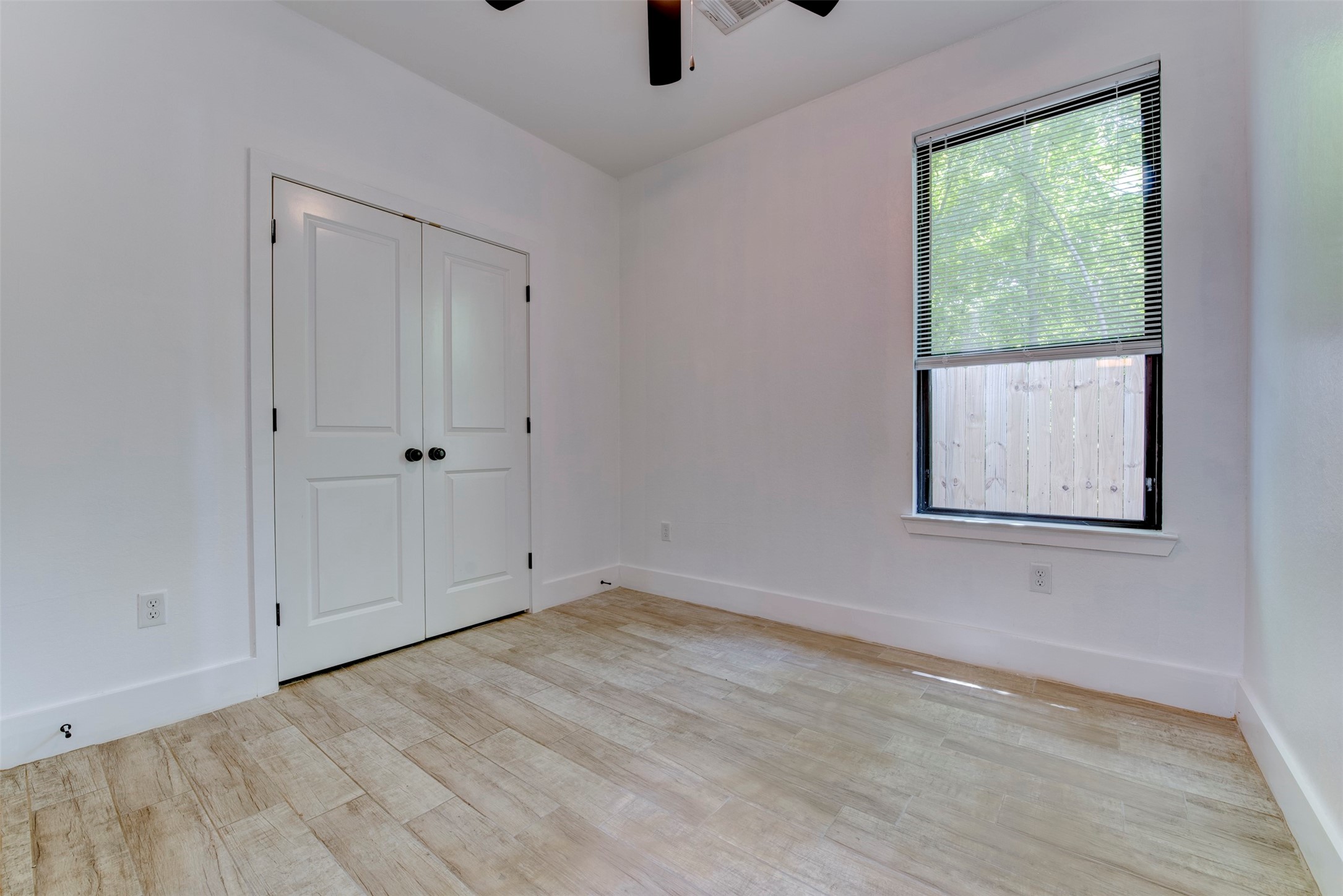 5121 Southwind Street, Unit B Houston, TX 77033 - Photo 20 of 24 a view of an empty room with a window