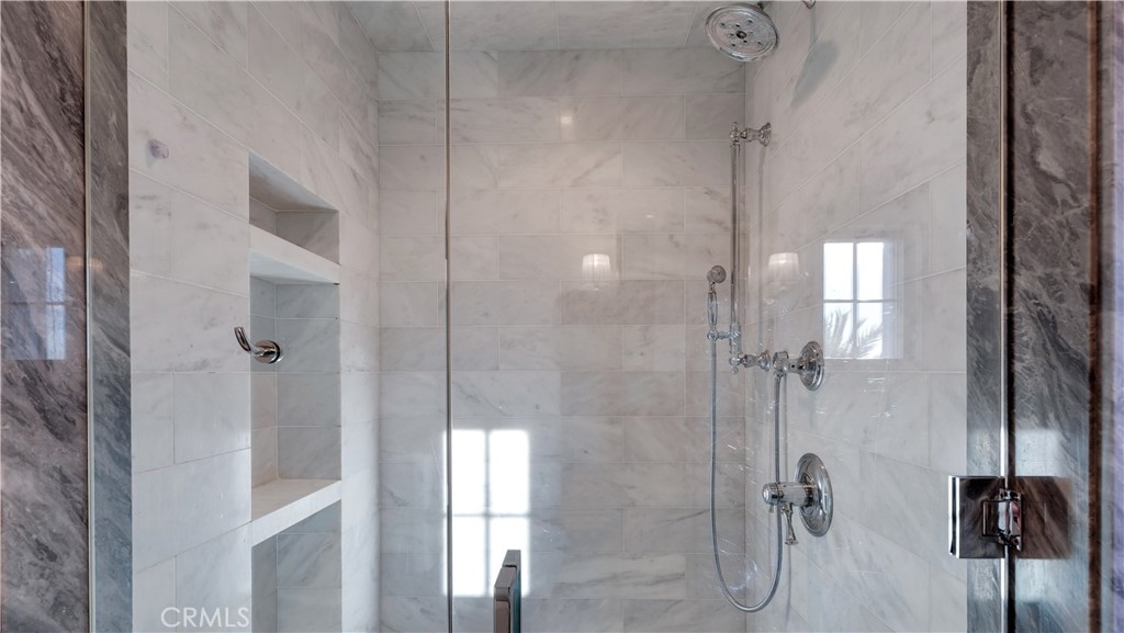 2 Thomas Road Ladera Ranch, CA 92694 - Photo 23 of 69 a bathroom with a glass shower door