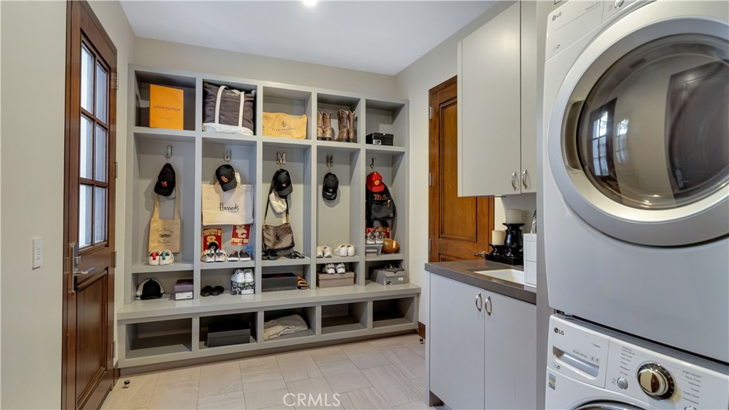 2 Thomas Road Ladera Ranch, CA 92694 - Photo 33 of 69 Wondering what to do with all the shoes, hats and backpacks? The first of 2 laundry areas provides storage for all of it.