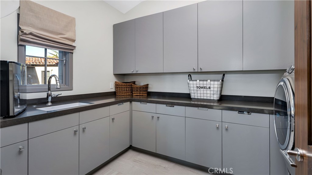 2 Thomas Road Ladera Ranch, CA 92694 - Photo 42 of 69 a kitchen with appliances a sink and cabinets