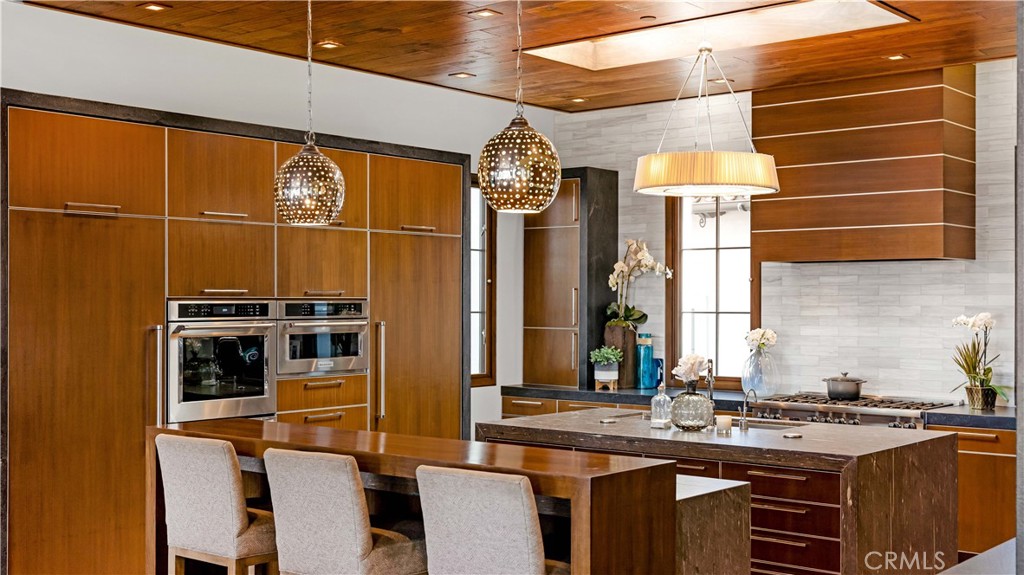 2 Thomas Road Ladera Ranch, CA 92694 - Photo 55 of 69 a kitchen with stainless steel appliances a stove and a refrigerator