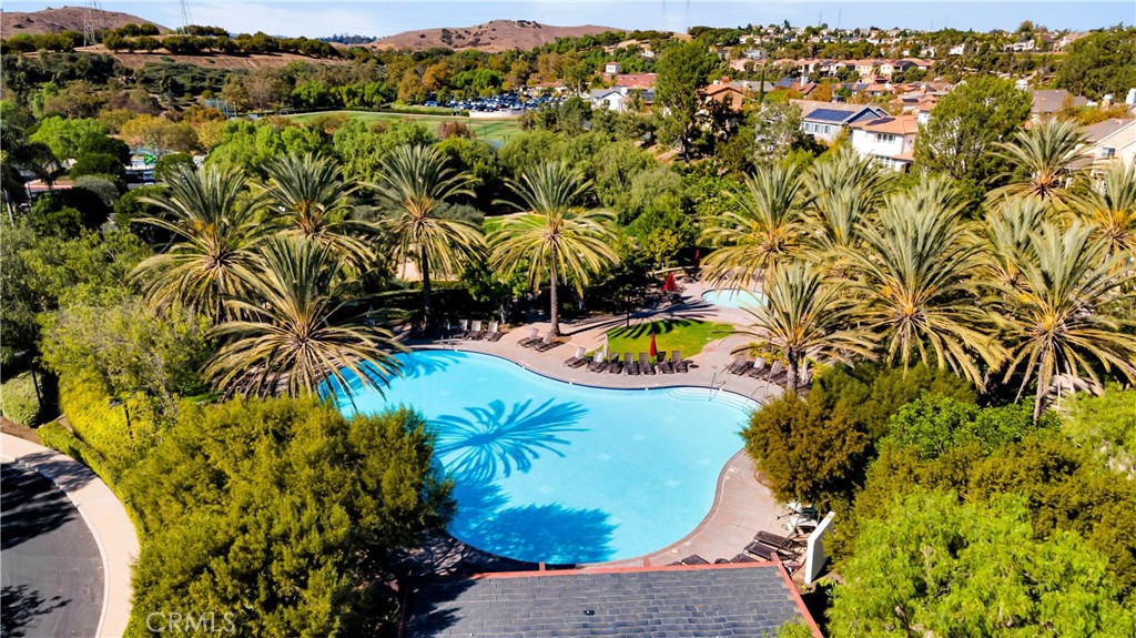 2 Thomas Road Ladera Ranch, CA 92694 - Photo 66 of 69 an aerial view of a swimming pool with a yard and mountain view