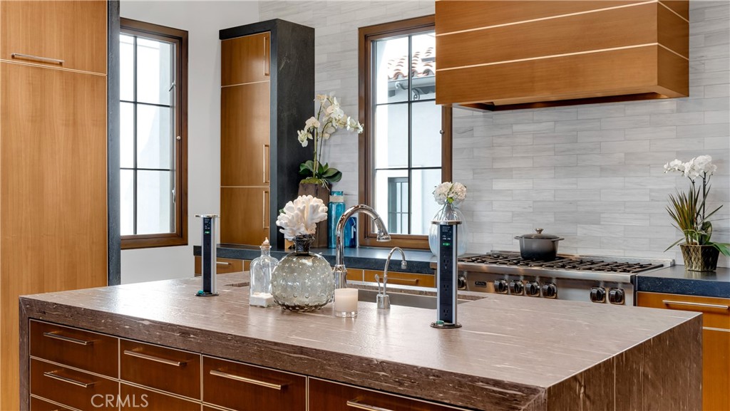 2 Thomas Road Ladera Ranch, CA 92694 - Photo 8 of 69 a kitchen with a sink a counter and cabinets