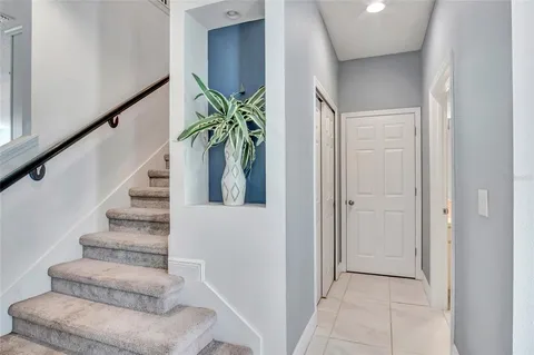 a view of entryway and hall with wooden floor