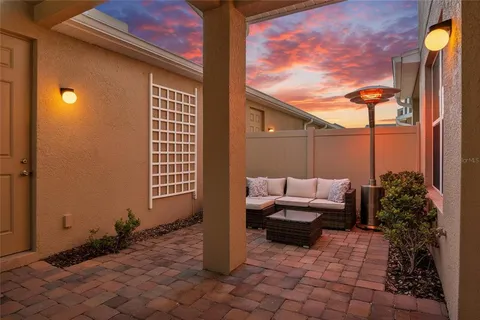 a outdoor space with patio furniture and potted plants