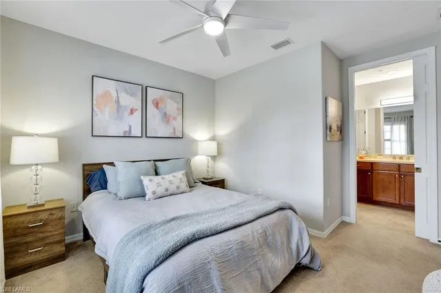 a bedroom with a bed and a view of bathroom