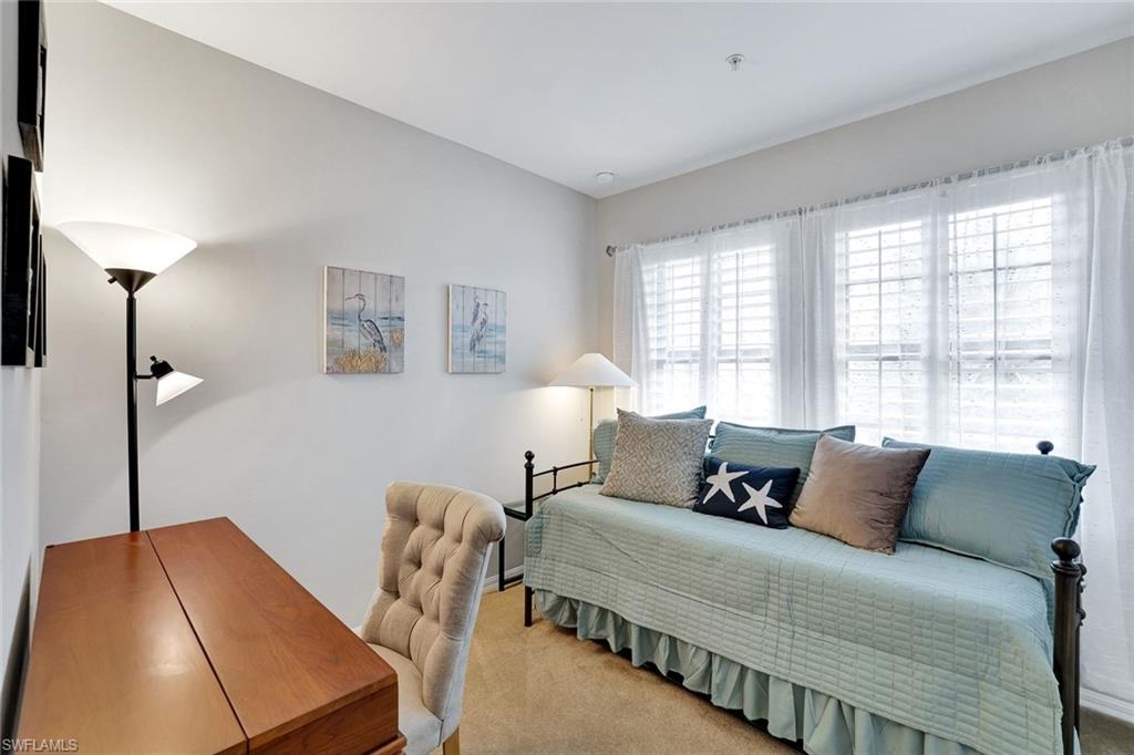 1383 Artesia Drive West, Unit 701 Naples, FL 34113 - Photo 16 of 43 a bedroom with bed and window