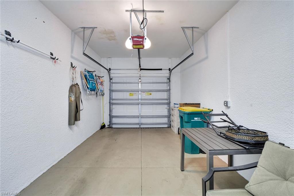 1383 Artesia Drive West, Unit 701 Naples, FL 34113 - Photo 19 of 43 a view of a room with storage and racks