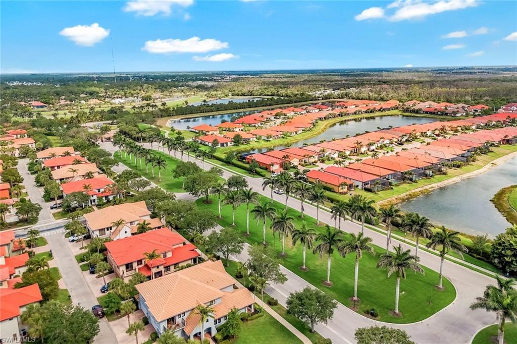 1383 Artesia Drive West, Unit 701 Naples, FL 34113 - Photo 22 of 43 an aerial view of residential houses with outdoor space