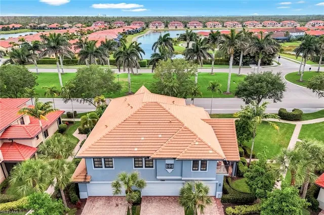 an aerial view of a house with a yard and a garden