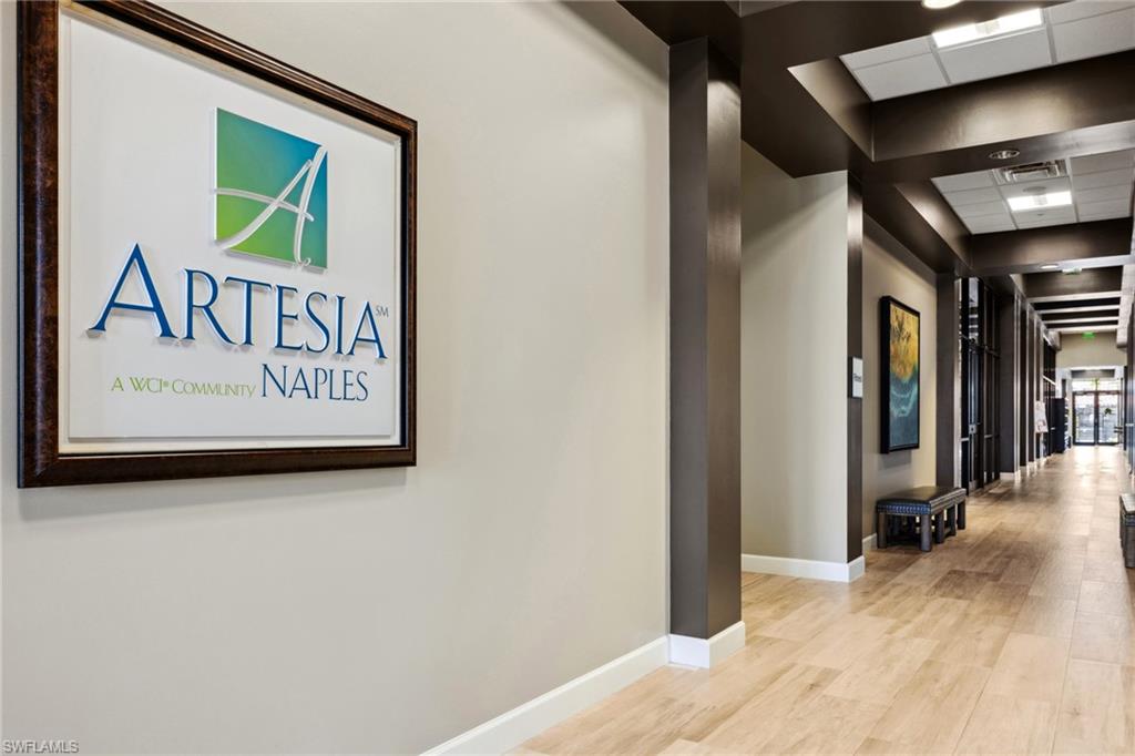 1383 Artesia Drive West, Unit 701 Naples, FL 34113 - Photo 28 of 43 a view of a hallway with wooden floor