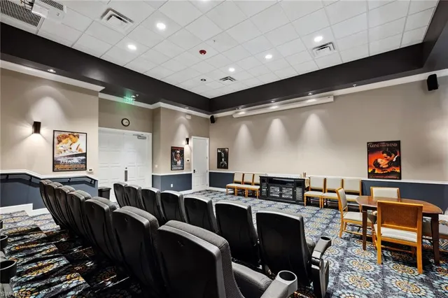 a living room with lots of furniture and a projector