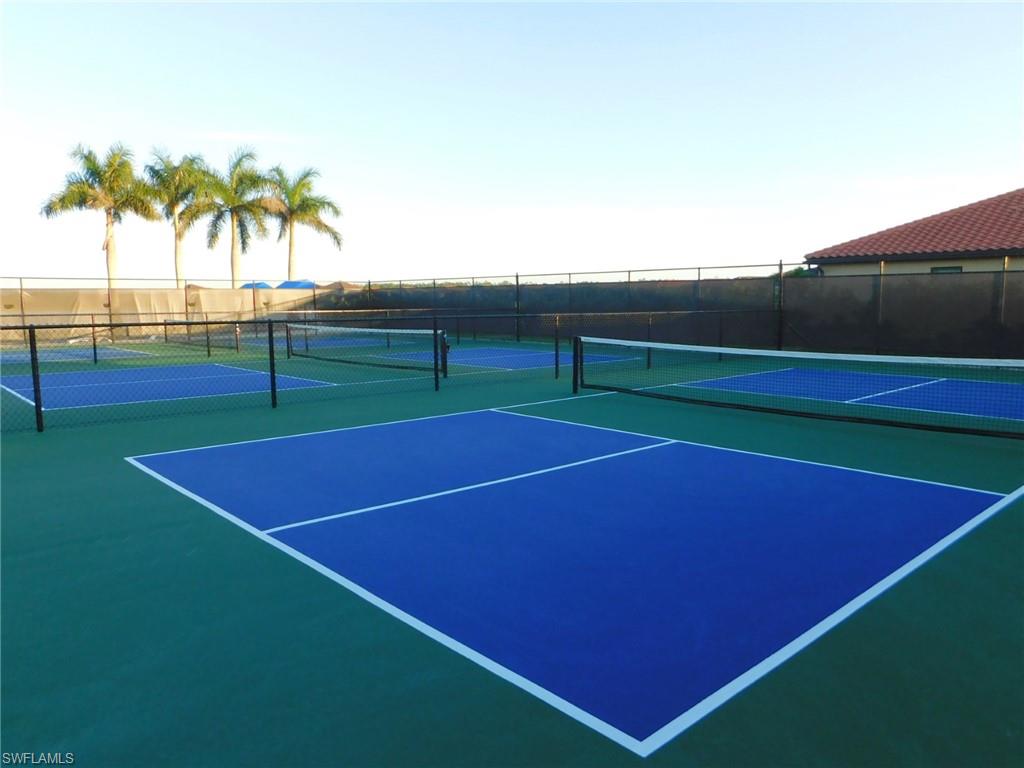 1383 Artesia Drive West, Unit 701 Naples, FL 34113 - Photo 40 of 43 a view of tennis court