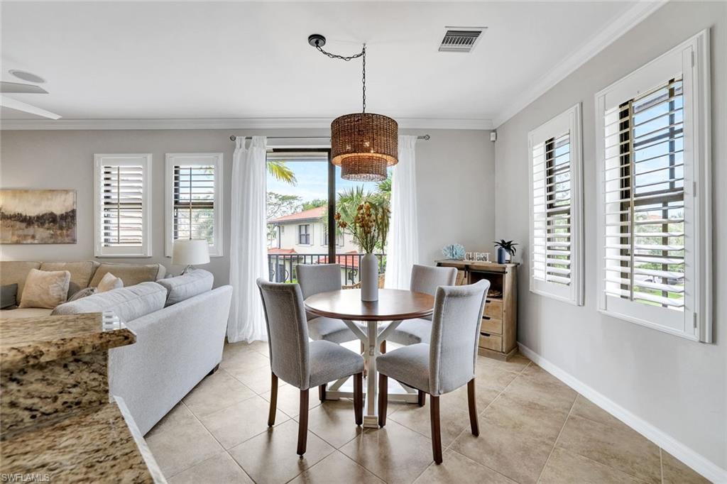 1383 Artesia Drive West, Unit 701 Naples, FL 34113 - Photo 7 of 43 a dining room with furniture and window