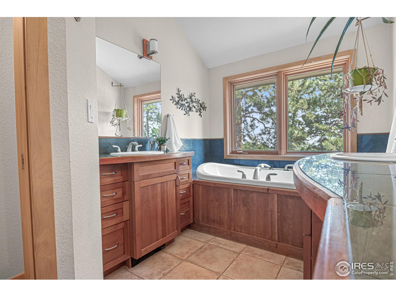 1107 Mountain Pines Road Boulder, CO 80302 - Photo 13 of 40 a kitchen with granite countertop a sink and a stove top oven