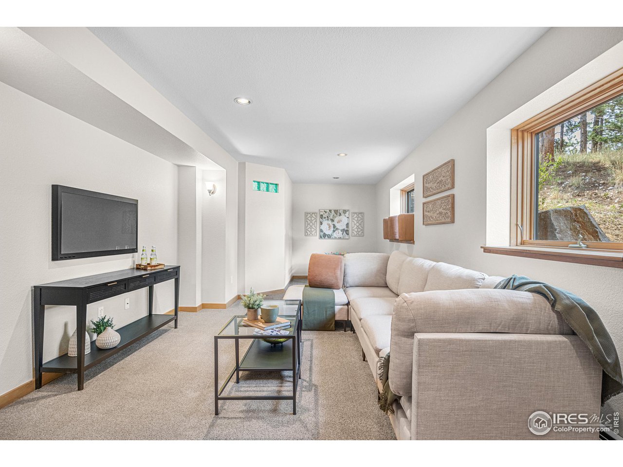 1107 Mountain Pines Road Boulder, CO 80302 - Photo 16 of 40 a living room with furniture and a flat screen tv