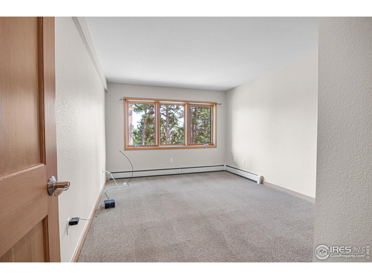 1107 Mountain Pines Road Boulder, CO 80302 - Photo 19 of 40 a view of an empty room with a window