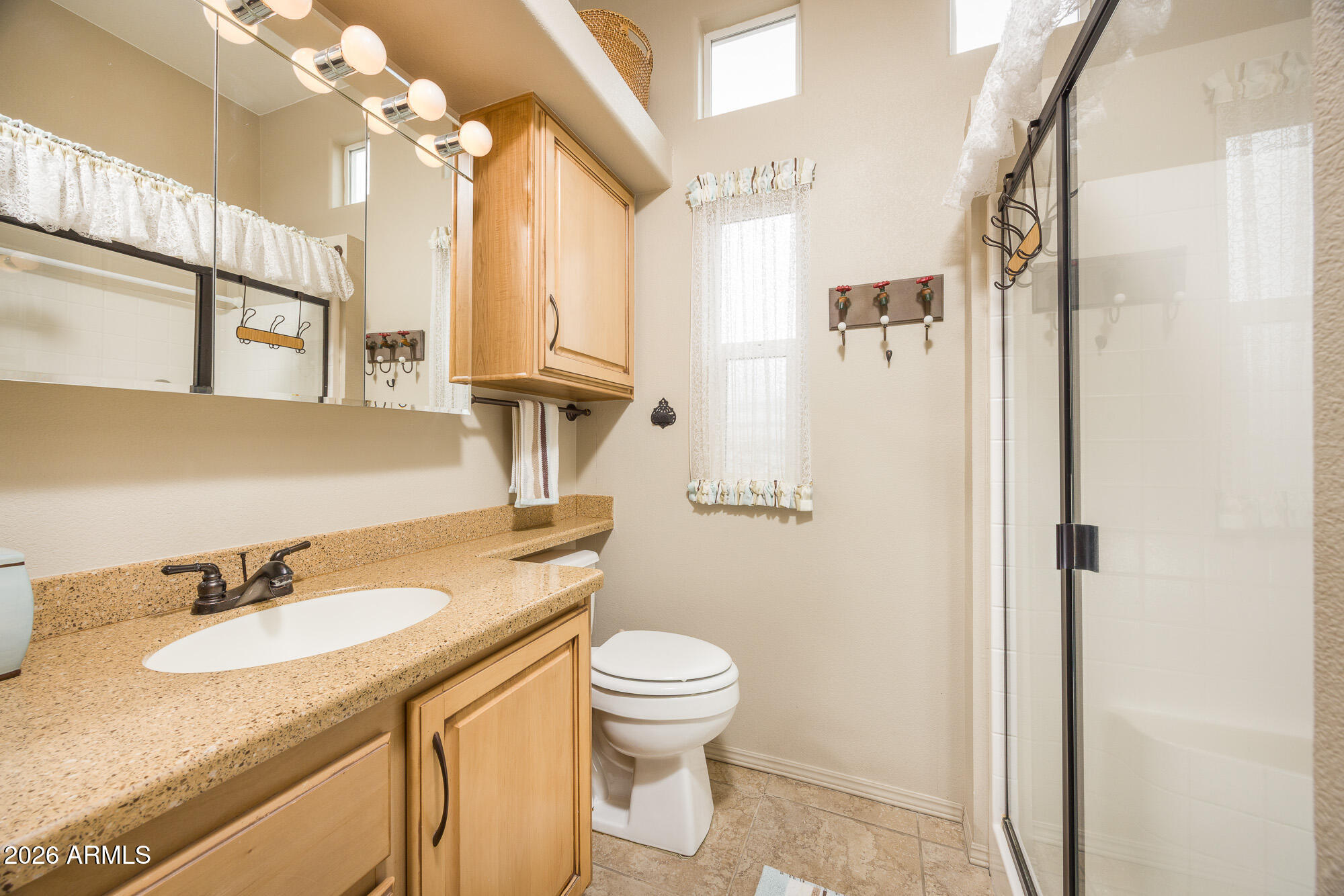 1030 Barrel Cactus Ridge, Unit 39 Benson, AZ 85602 - Photo 12 of 36 a bathroom with a granite countertop sink toilet and shower