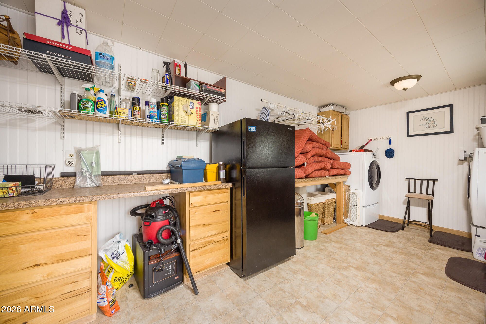 1030 Barrel Cactus Ridge, Unit 39 Benson, AZ 85602 - Photo 16 of 36 a view of a kitchen with fridge and workspace