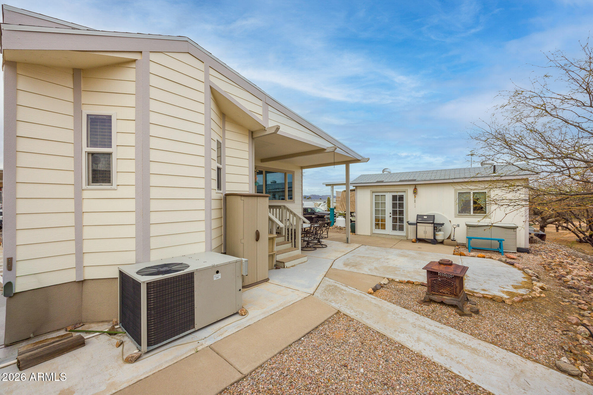 1030 Barrel Cactus Ridge, Unit 39 Benson, AZ 85602 - Photo 19 of 36 a view of a dinning table and chairs in the patio