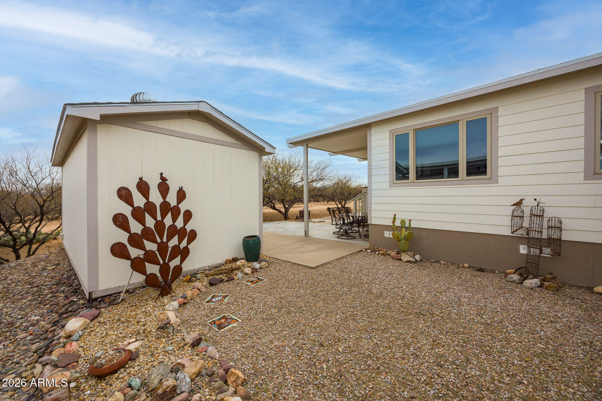 1030 Barrel Cactus Ridge, Unit 39 Benson, AZ 85602 - Photo 25 of 36 a backyard of a house