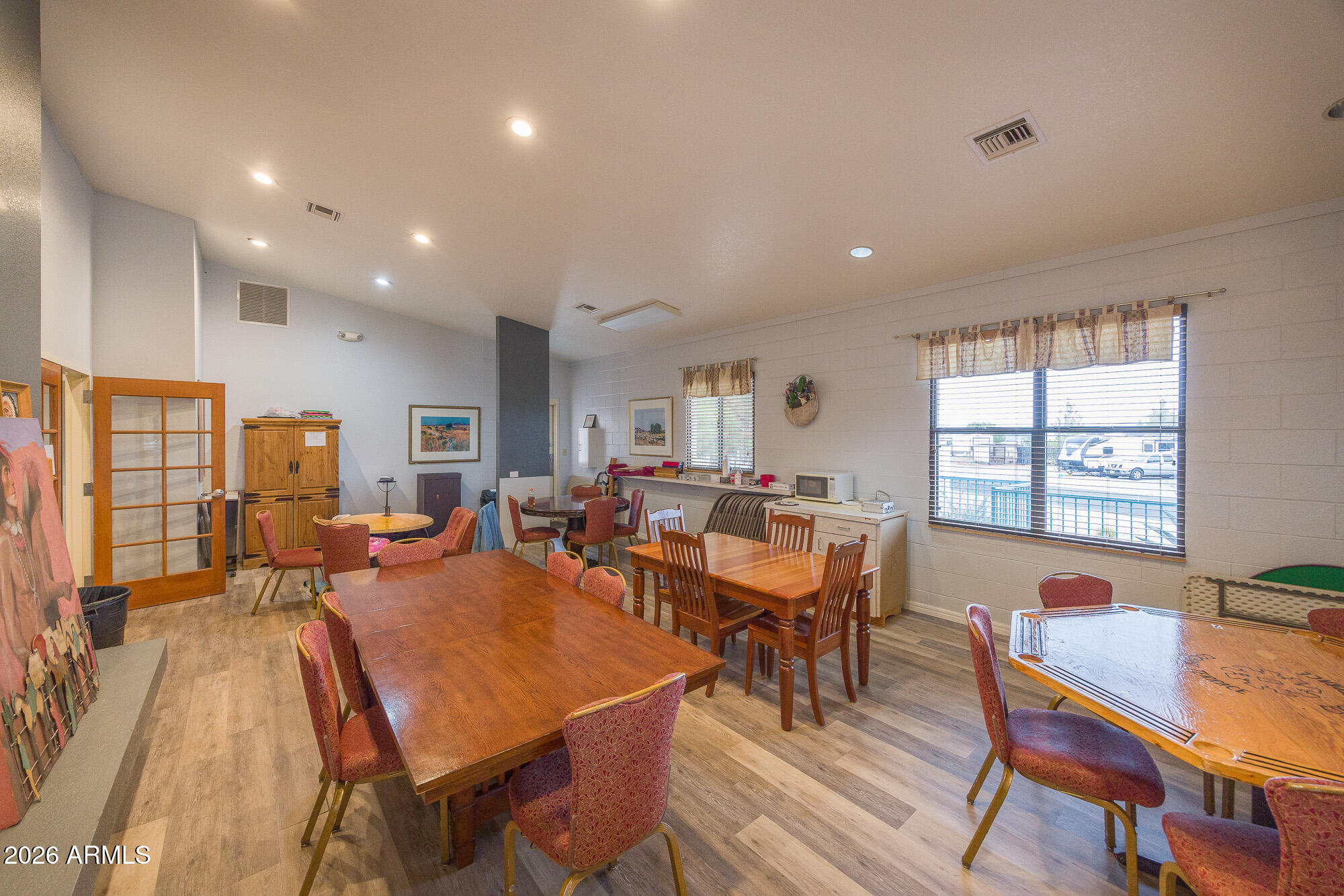 1030 Barrel Cactus Ridge, Unit 39 Benson, AZ 85602 - Photo 30 of 36 a view of a dining room with furniture window and wooden floor