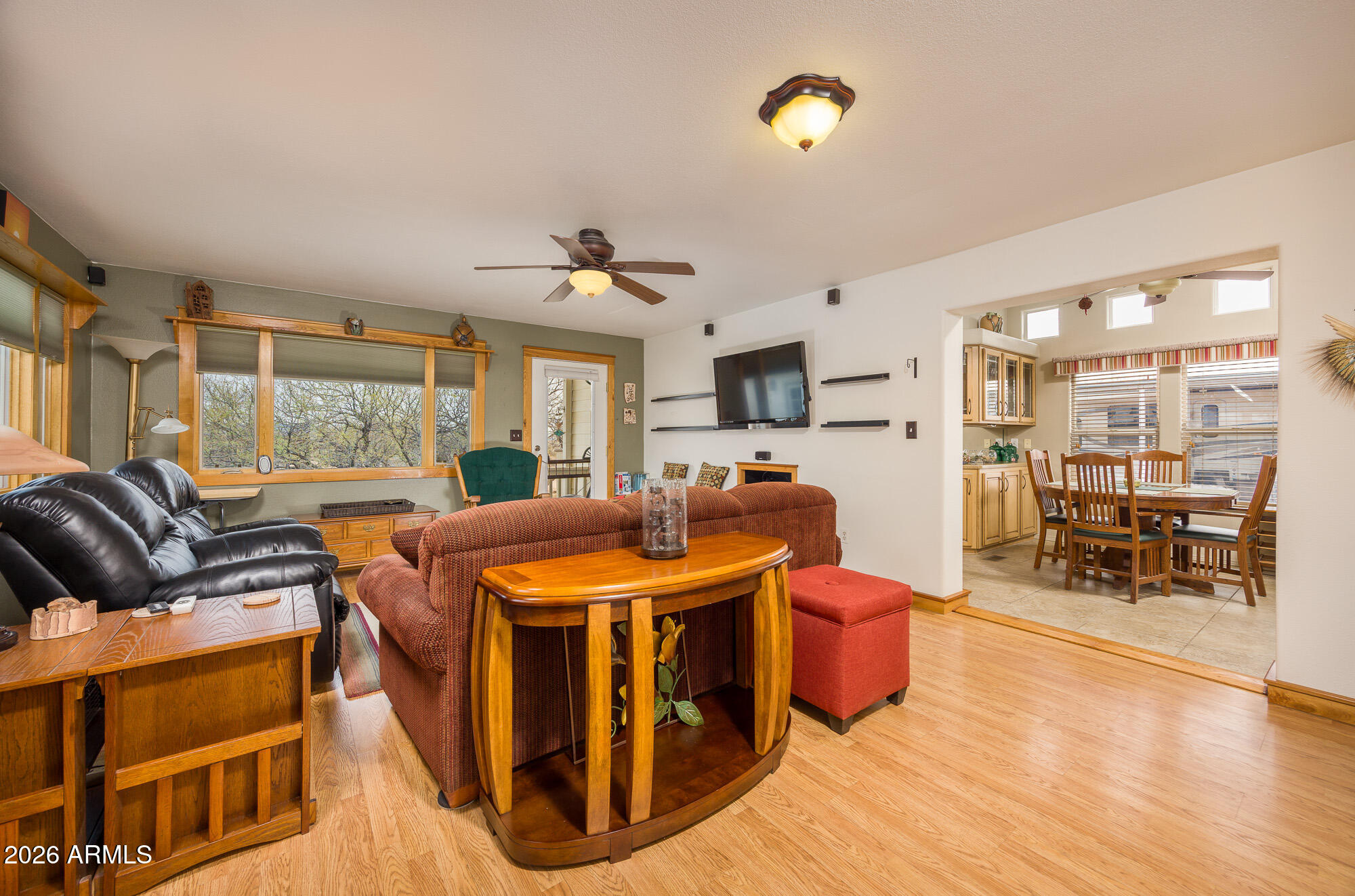 1030 Barrel Cactus Ridge, Unit 39 Benson, AZ 85602 - Photo 3 of 36 a living room with furniture a wooden floor and a large window