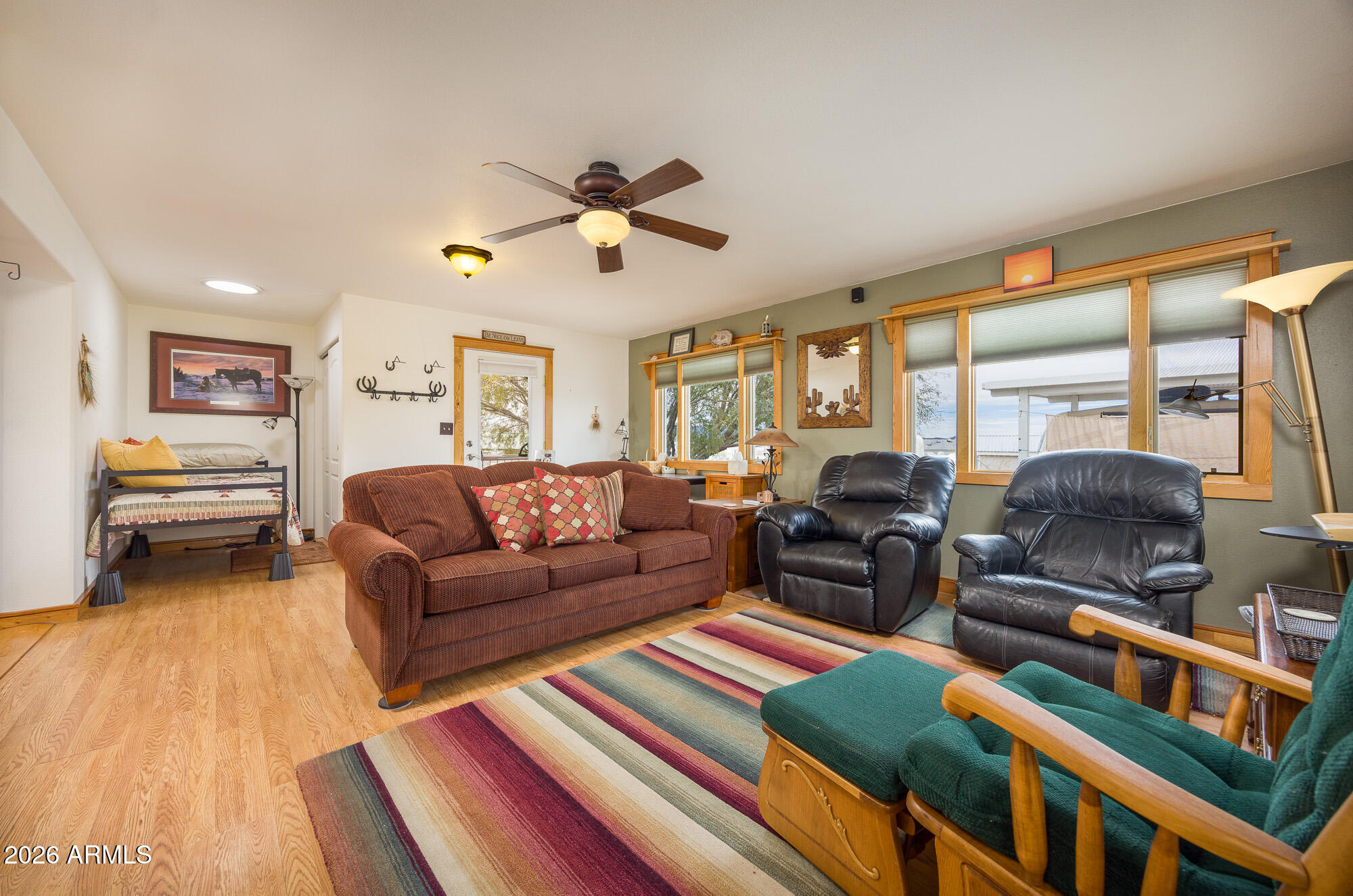 1030 Barrel Cactus Ridge, Unit 39 Benson, AZ 85602 - Photo 4 of 36 a living room with furniture fireplace and a large window