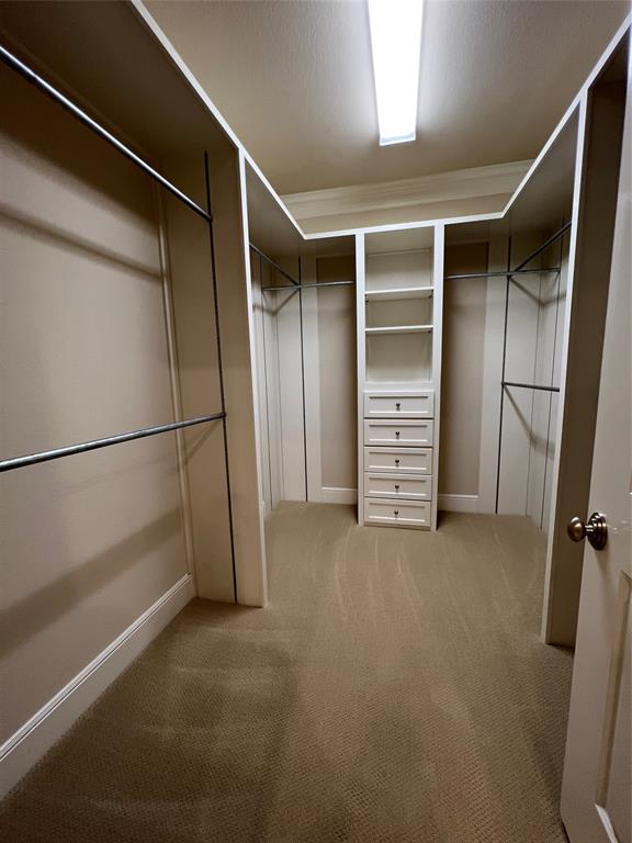 6525 Bandera Avenue, Unit 2B Dallas, TX 75225 - Photo 16 of 24 a view of walk in closet with clothes