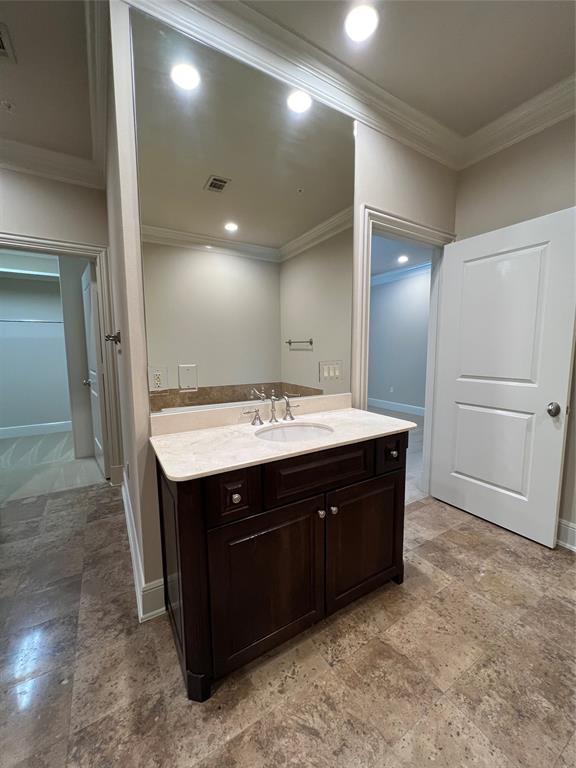 6525 Bandera Avenue, Unit 2B Dallas, TX 75225 - Photo 17 of 24 a bathroom with a sink and a mirror