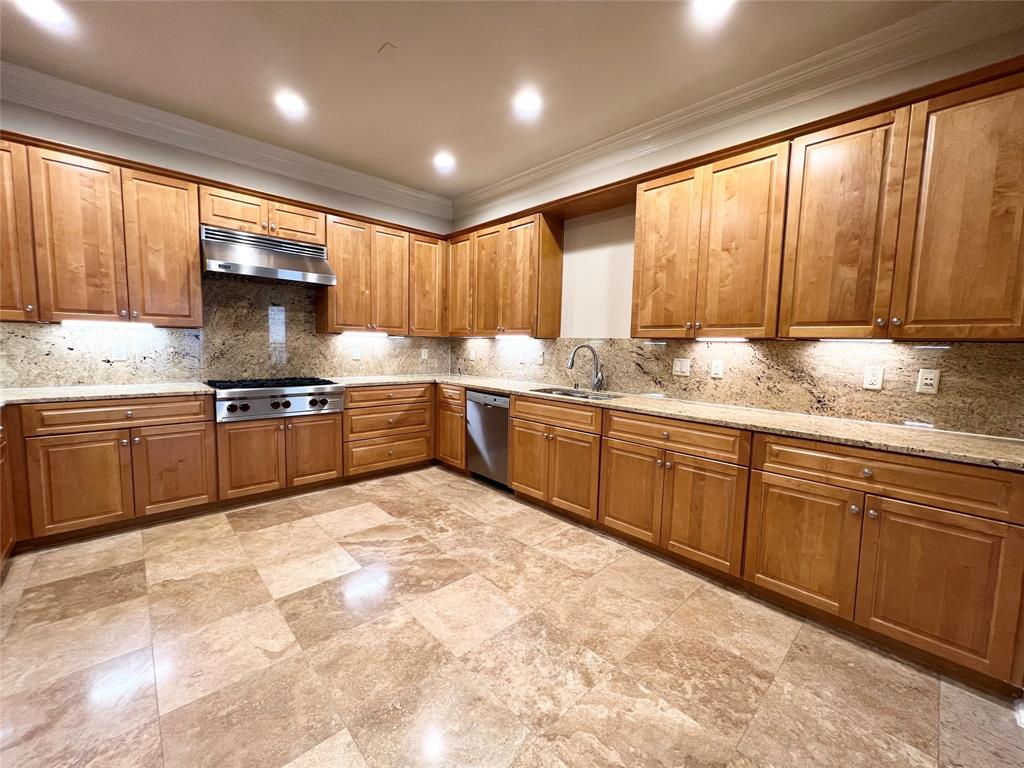 6525 Bandera Avenue, Unit 2B Dallas, TX 75225 - Photo 2 of 24 a kitchen with stainless steel appliances granite countertop a stove sink and cabinets