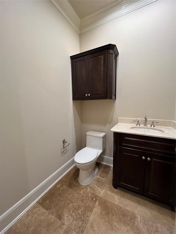 6525 Bandera Avenue, Unit 2B Dallas, TX 75225 - Photo 23 of 24 a bathroom with a sink and a toilet