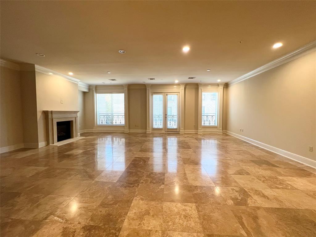6525 Bandera Avenue, Unit 2B Dallas, TX 75225 - Photo 4 of 24 a view of empty room with wooden floor and fireplace