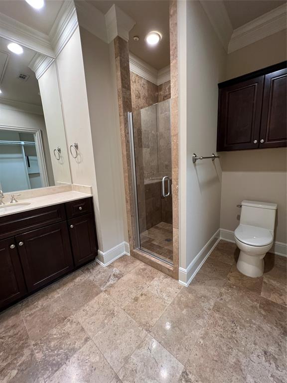 6525 Bandera Avenue, Unit 2B Dallas, TX 75225 - Photo 7 of 24 a bathroom with a toilet sink and a mirror