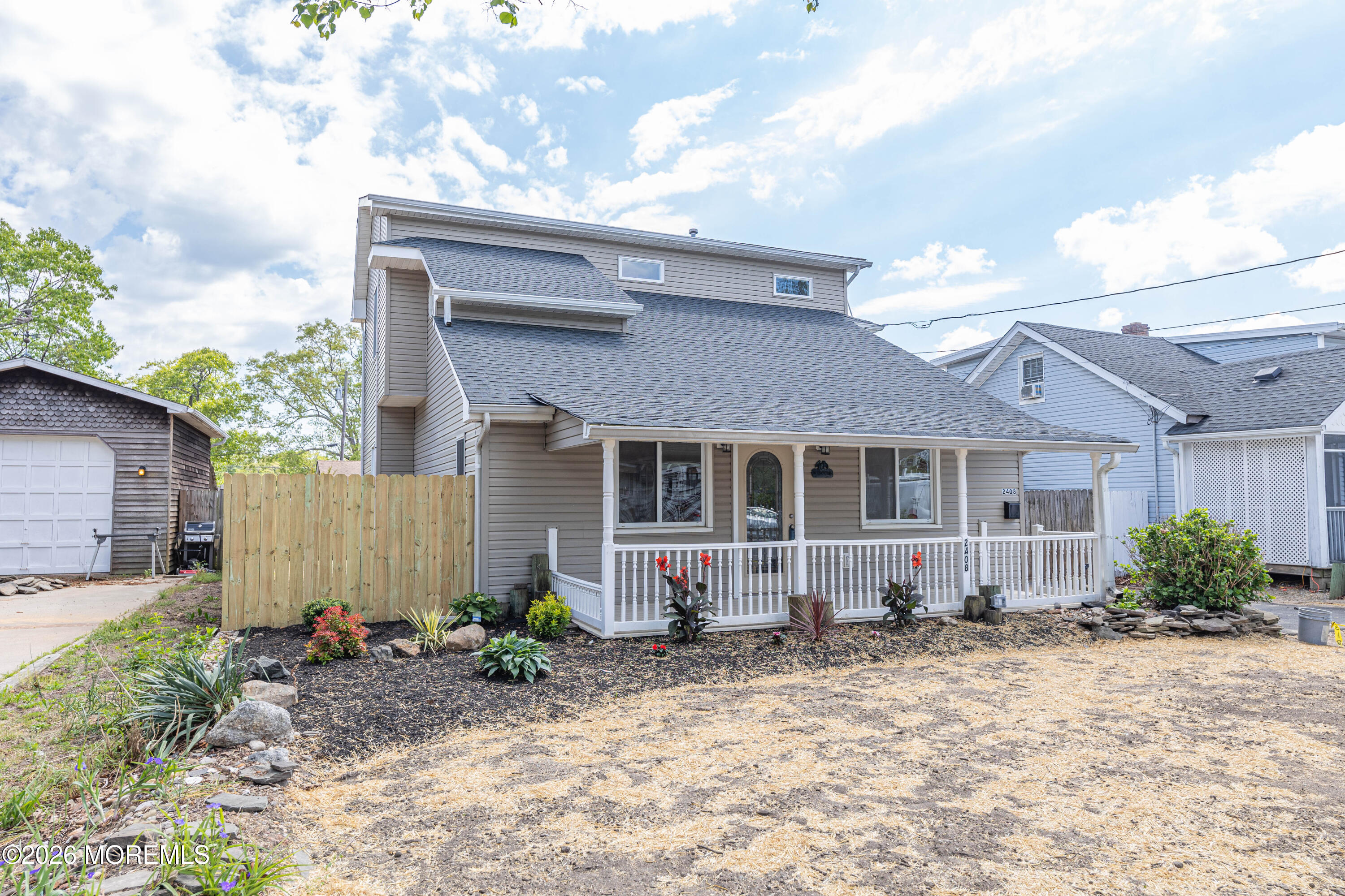 2408 Herbertsville Road Point Pleasant, NJ 08742 - Photo 69 of 82 a front view of a house with garden