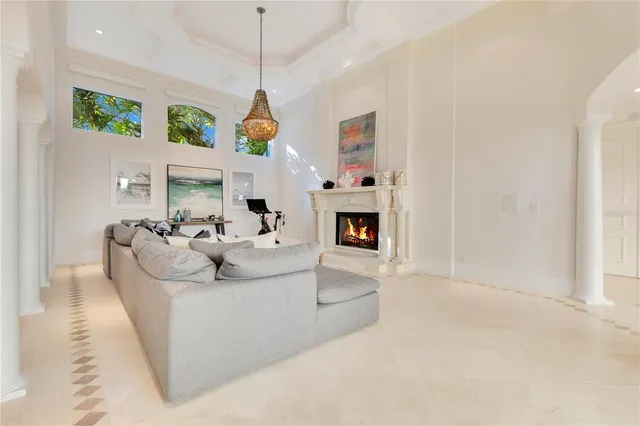 a spacious en suite bathroom with a double vanity sink a mirror a bathtub and shower