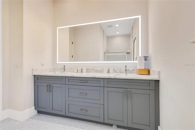 a view of a dinning table and chairs in patio of the house